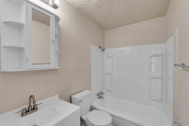 full bathroom with bathtub / shower combination, toilet, vanity, and a textured ceiling