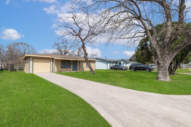 single story home with a garage, concrete driveway, and a front yard