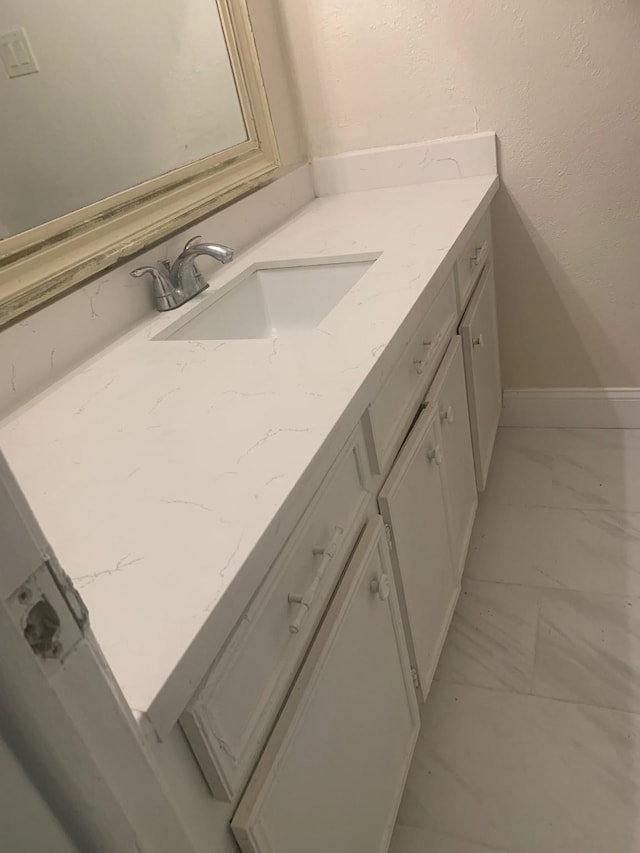 11603 Counselor St, Houston, TX 77065 - bathroom featuring marble look tiles and vanity
