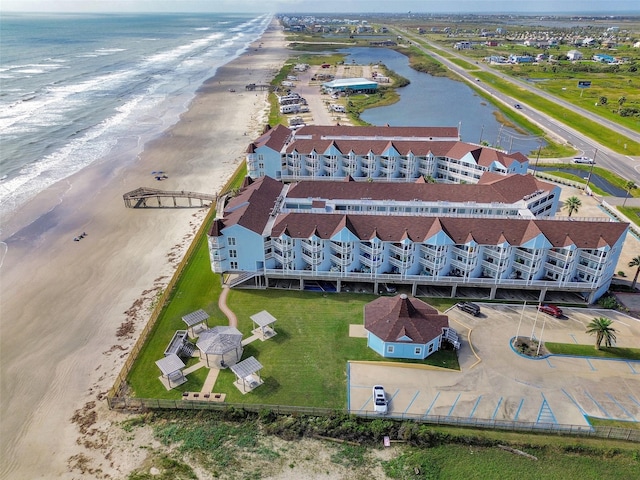 aerial view with a view of the beach and a water view