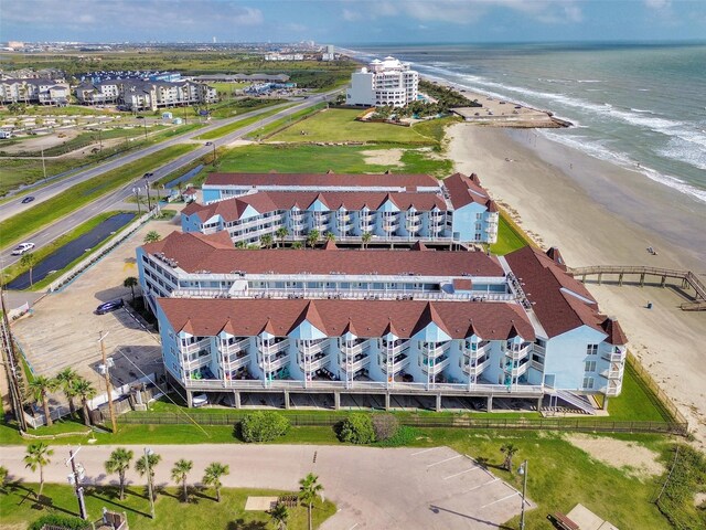 bird's eye view featuring a water view and a view of the beach