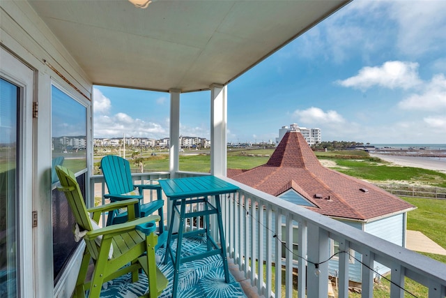 balcony featuring a sunroom