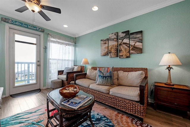 living area featuring ceiling fan, recessed lighting, wood finished floors, and ornamental molding