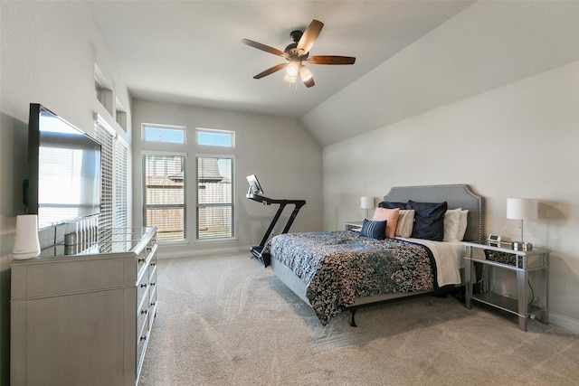 bedroom featuring baseboards, light colored carpet, lofted ceiling, and a ceiling fan