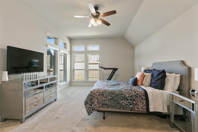 bedroom featuring a ceiling fan, carpet, and vaulted ceiling