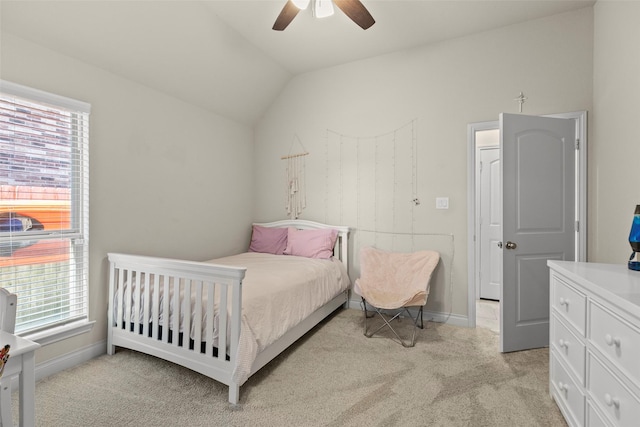 bedroom featuring multiple windows, light colored carpet, and vaulted ceiling