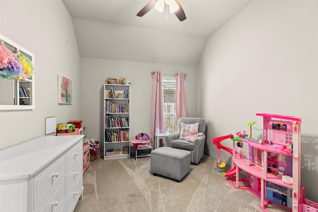 playroom featuring light carpet, a ceiling fan, and vaulted ceiling