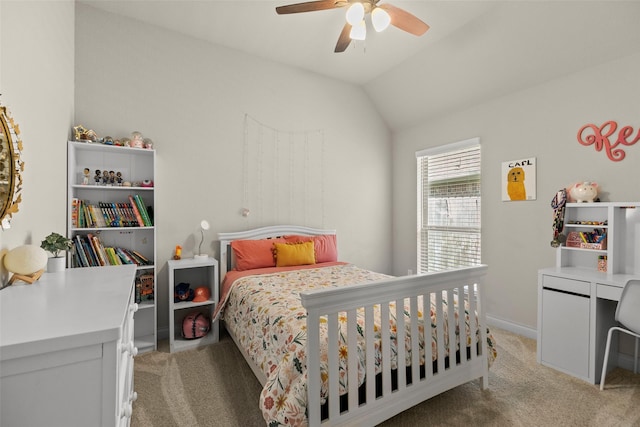 bedroom with light carpet, baseboards, a ceiling fan, and lofted ceiling