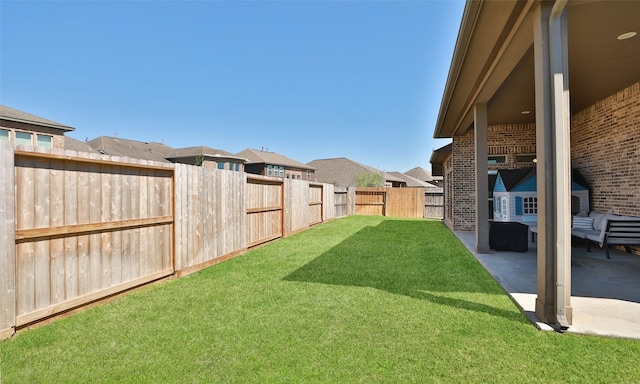 view of yard with a patio area and a fenced backyard