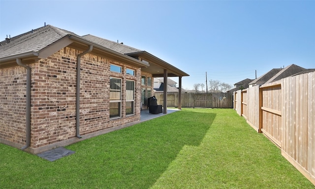 view of yard with a patio and a fenced backyard