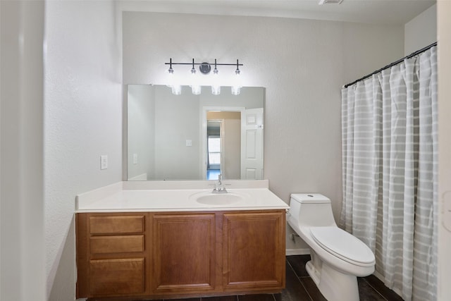 bathroom featuring a shower with shower curtain, toilet, vanity, and tile patterned flooring