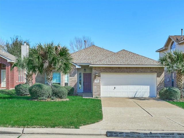 single story home featuring brick siding, a front lawn, concrete driveway, roof with shingles, and an attached garage