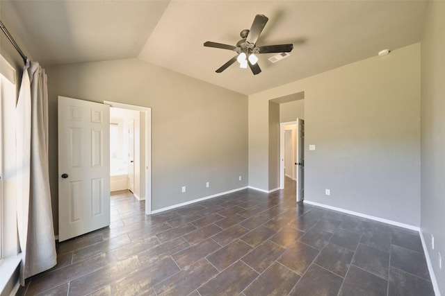 unfurnished bedroom featuring baseboards, lofted ceiling, and ceiling fan