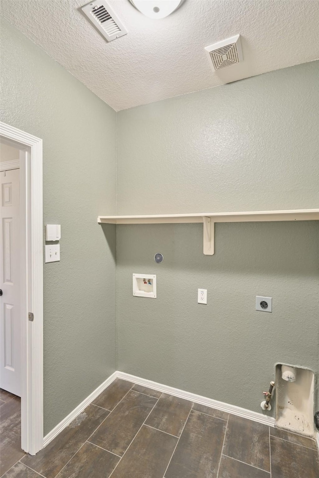 clothes washing area featuring visible vents, gas dryer hookup, washer hookup, and laundry area