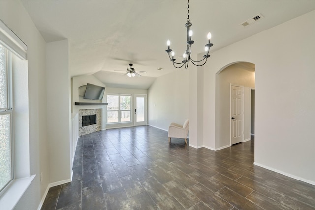 unfurnished living room with visible vents, baseboards, dark wood-type flooring, and a fireplace