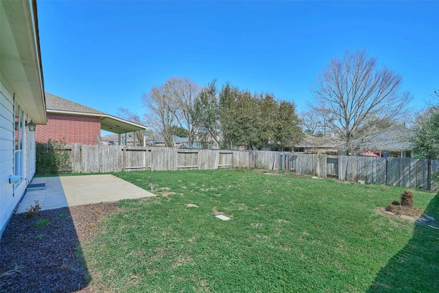 view of yard featuring a patio area and a fenced backyard