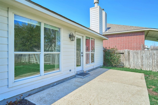 view of patio / terrace featuring fence