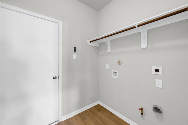 washroom featuring baseboards, gas dryer hookup, laundry area, hookup for a washing machine, and wood finished floors