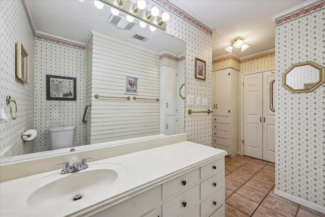 bathroom featuring visible vents, ornamental molding, and wallpapered walls