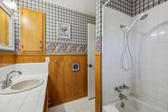 full bathroom featuring shower / bathtub combination with curtain, vanity, wainscoting, and wallpapered walls