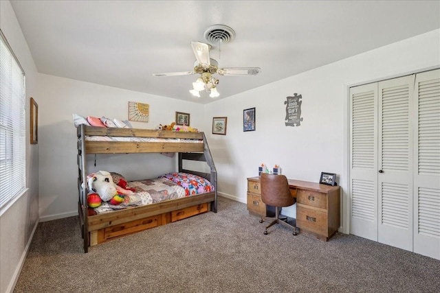 bedroom with visible vents, a ceiling fan, a closet, carpet floors, and baseboards