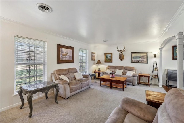 living area with visible vents, light carpet, crown molding, baseboards, and ornate columns