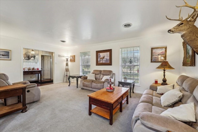 carpeted living room featuring baseboards and visible vents