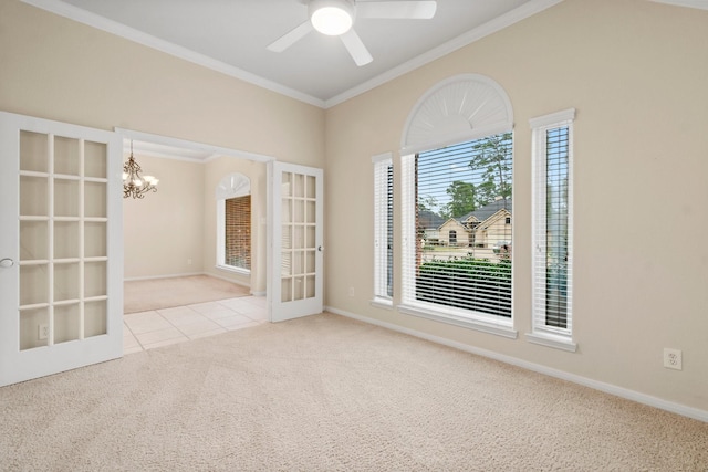 tiled empty room featuring baseboards, ornamental molding, carpet floors, ceiling fan with notable chandelier, and french doors