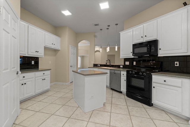 kitchen featuring visible vents, arched walkways, black appliances, and light tile patterned flooring