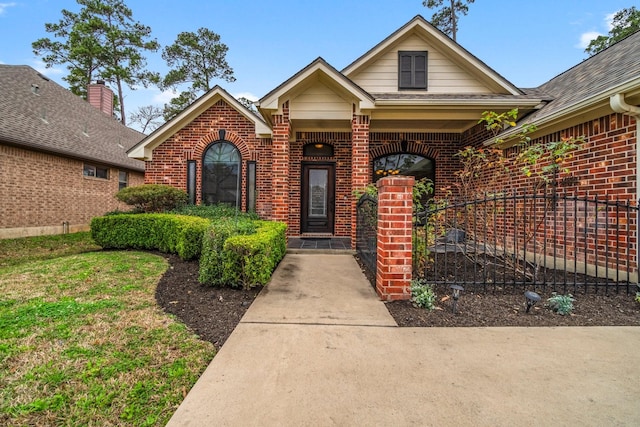 view of front of house featuring brick siding