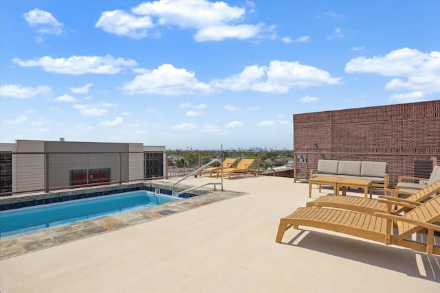 view of swimming pool with a patio