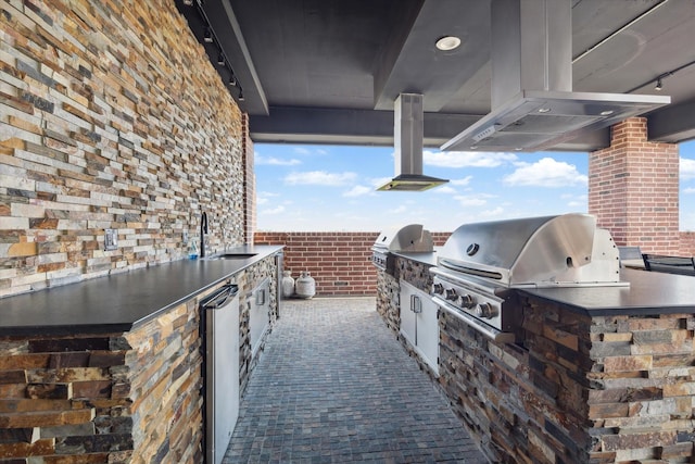 view of patio featuring a sink and area for grilling