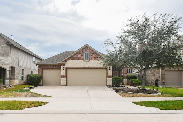 view of front of property with a garage, brick siding, and concrete driveway