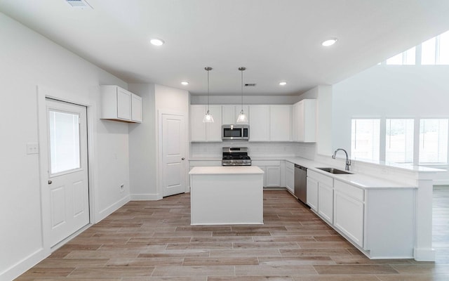 409 Twin Lakes Blvd, West Columbia, TX 77486 - kitchen with stainless steel appliances, a sink, healthy amount of natural light, decorative backsplash, and recessed lighting