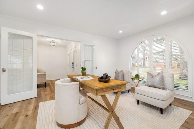 office area featuring recessed lighting, light wood-type flooring, baseboards, and crown molding