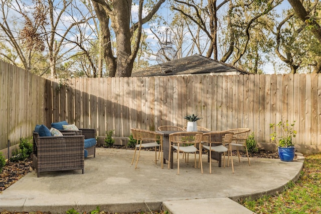 view of patio / terrace with outdoor dining space and a fenced backyard