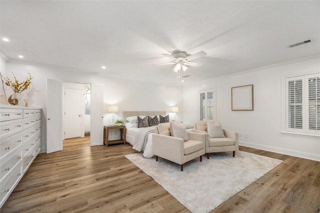 bedroom featuring recessed lighting, visible vents, and light wood finished floors