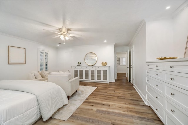 bedroom featuring recessed lighting, light wood-type flooring, baseboards, and ornamental molding