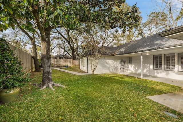 view of yard featuring a patio and a fenced backyard