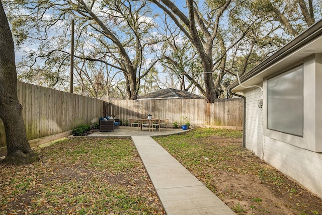 view of yard featuring a fenced backyard and a patio