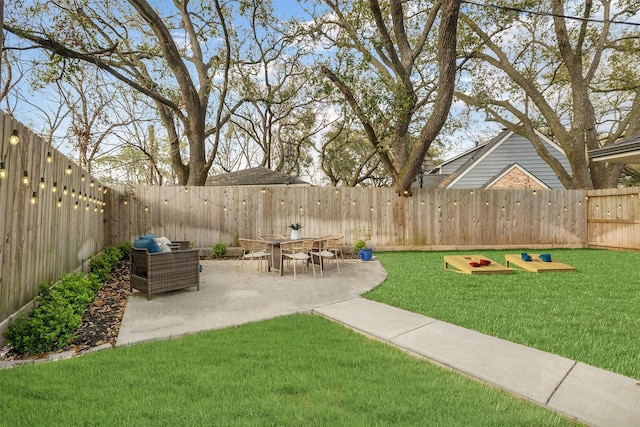 view of yard with a patio area and a fenced backyard