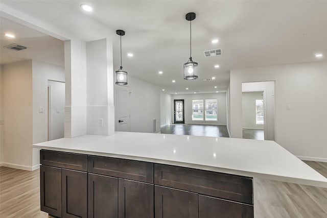 kitchen featuring recessed lighting, visible vents, and light wood finished floors