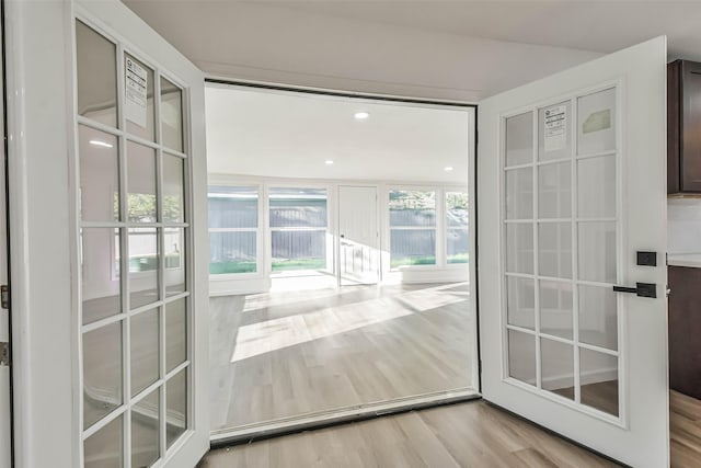 doorway to outside featuring wood finished floors