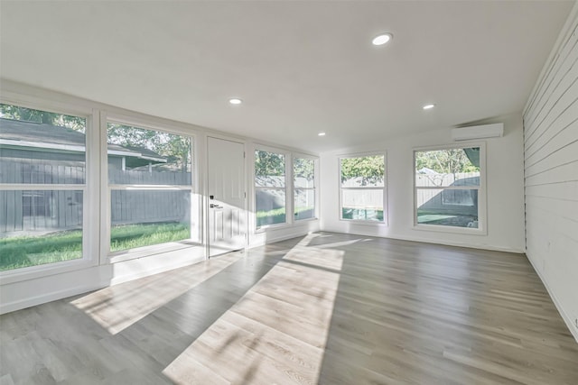 interior space with a wall mounted AC