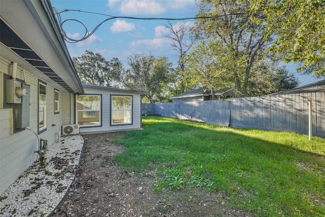 view of yard featuring ac unit and a fenced backyard