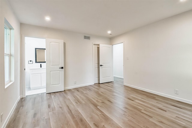 unfurnished bedroom with recessed lighting, visible vents, baseboards, and light wood-style floors