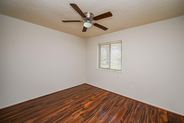 spare room with ceiling fan, a textured ceiling, and wood finished floors