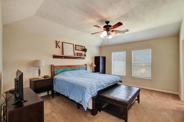 bedroom with light carpet, a textured ceiling, baseboards, ceiling fan, and vaulted ceiling