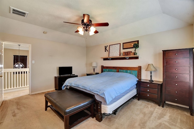 bedroom with visible vents, ceiling fan with notable chandelier, carpet, baseboards, and vaulted ceiling