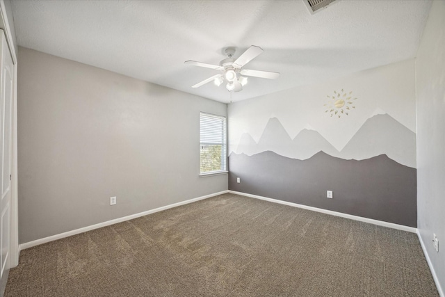 unfurnished room with visible vents, a ceiling fan, baseboards, and carpet floors